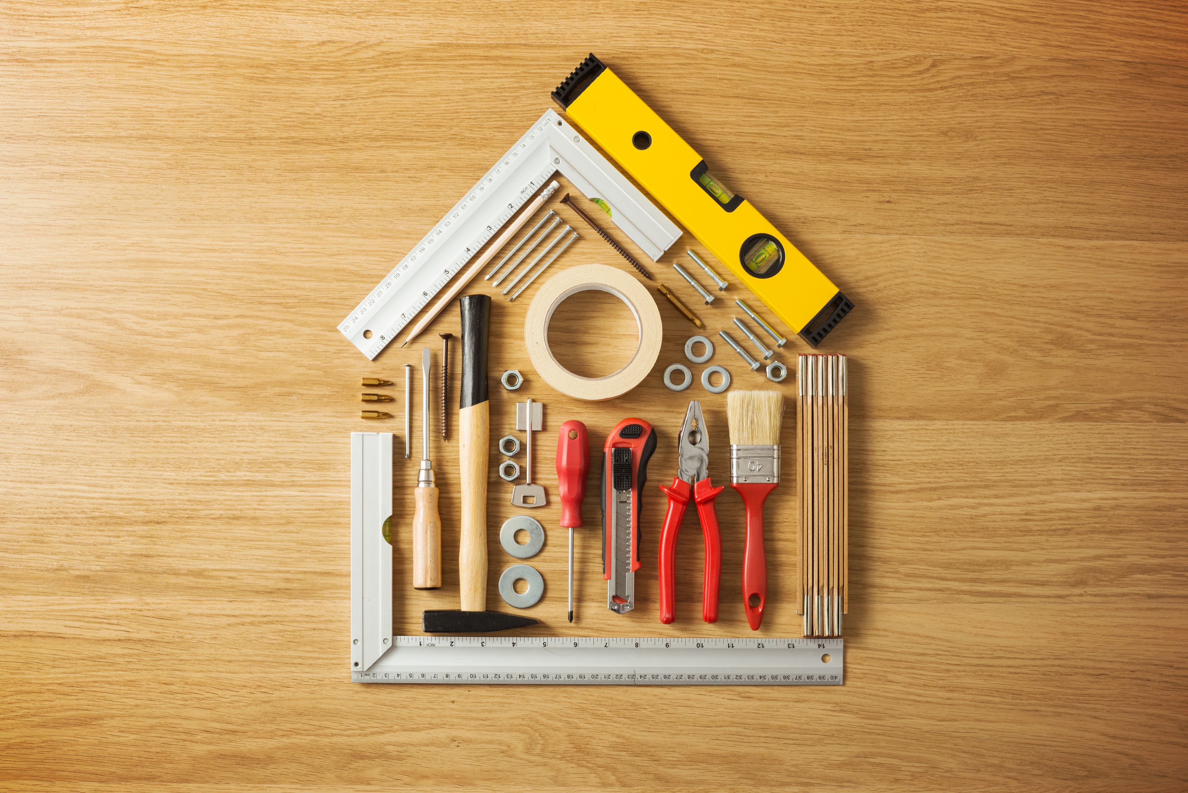 Hand tools arranged in the shape of a house